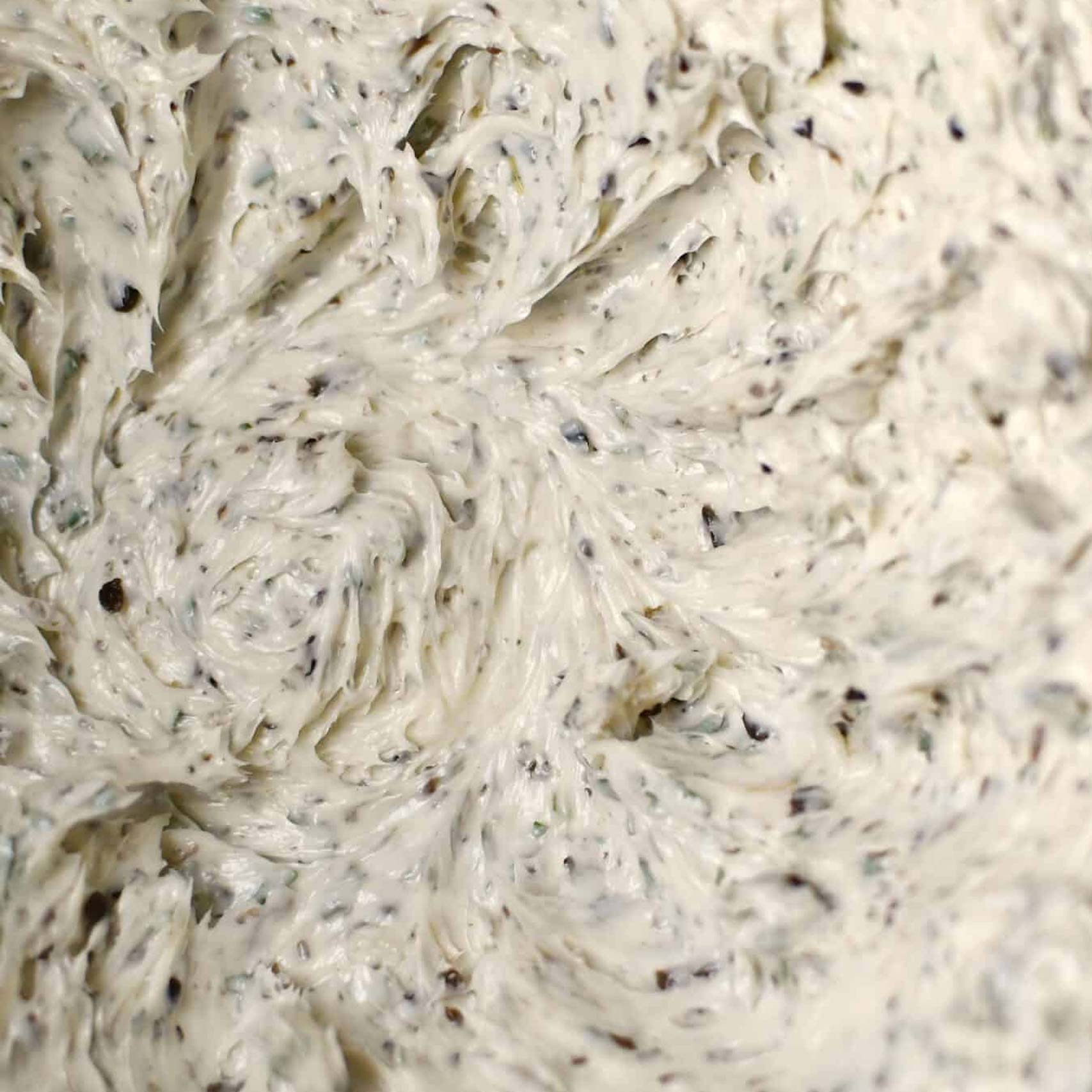 Green palm leaf beside two blank white cards on a white background.