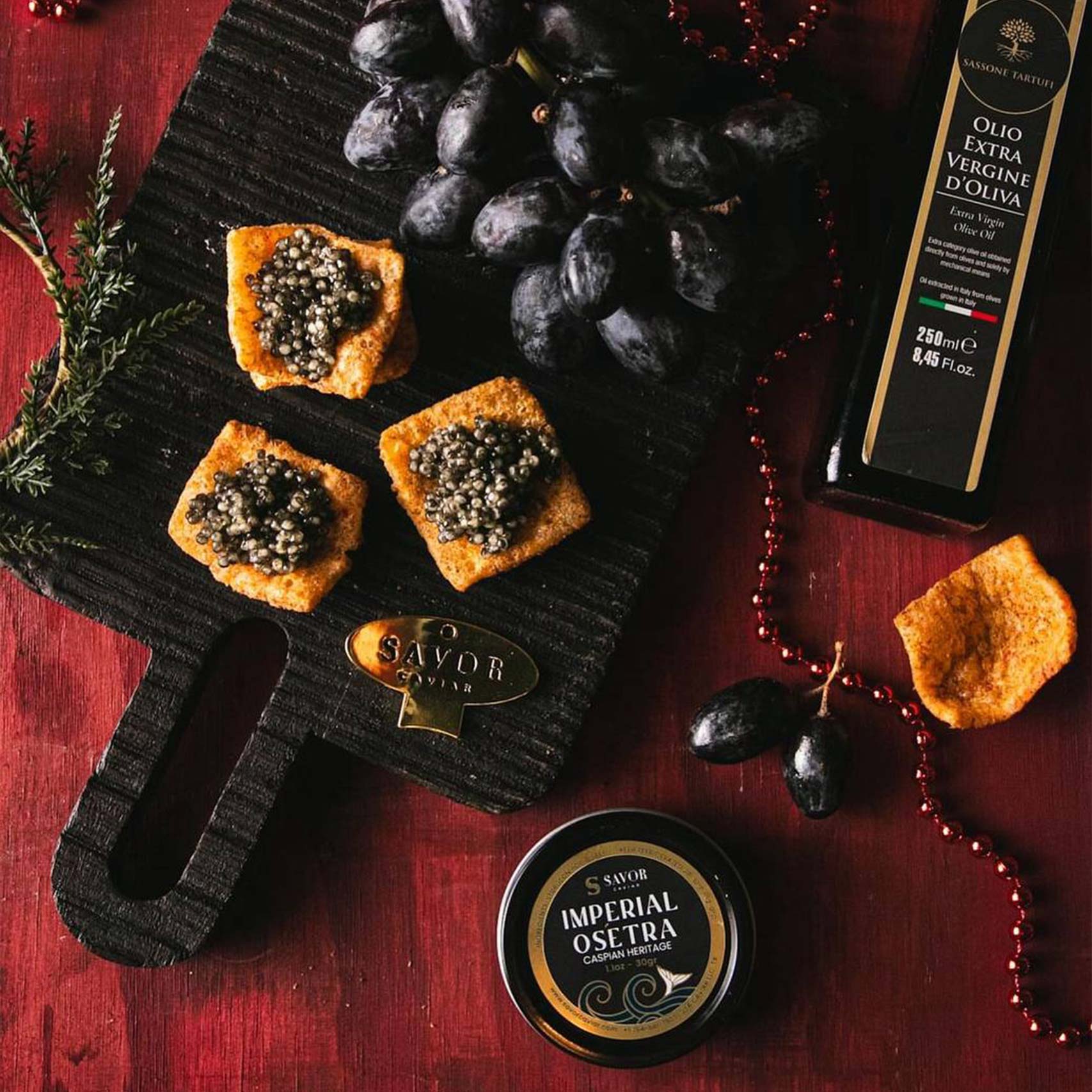 A single green leaf in a clear glass of water on white background.