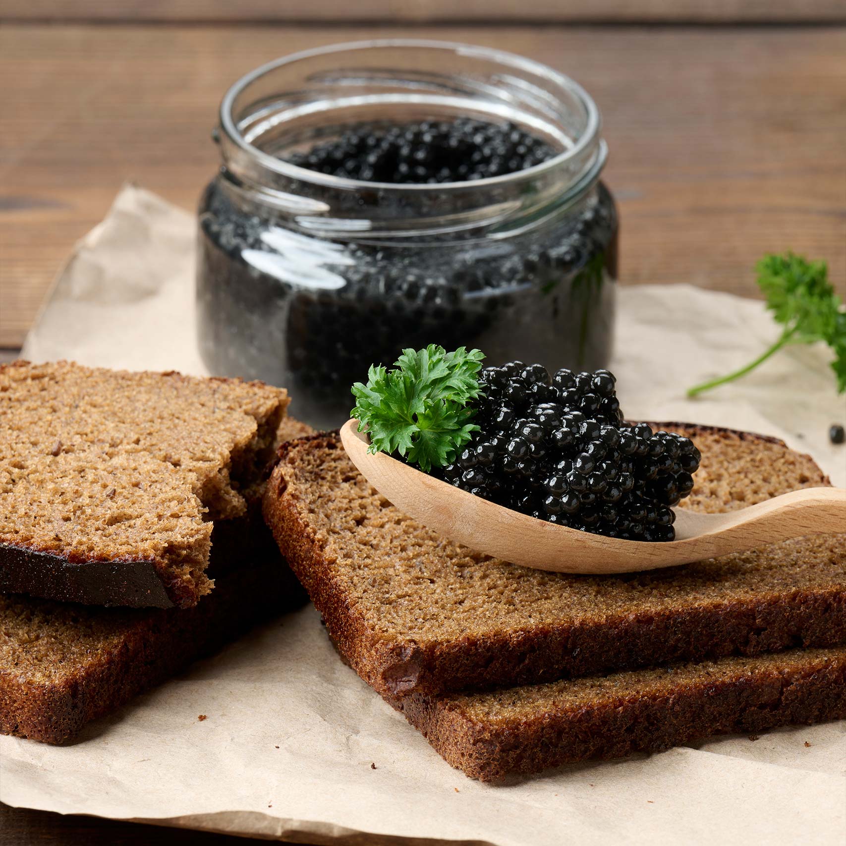 Green palm leaf beside two blank white cards on a white background.