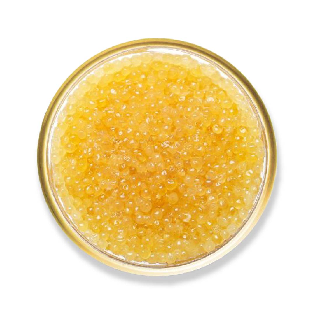 Yellow caviar in a glass dish on a white background