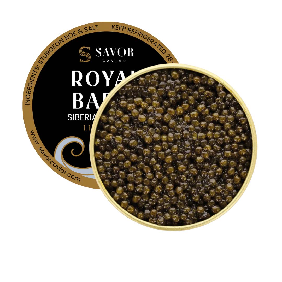 Open tin of Royal Baerii caviar featuring medium to large olive-brown Siberian sturgeon roe pearls alongside Savor Caviar black and gold product label on a light background. #size_30g