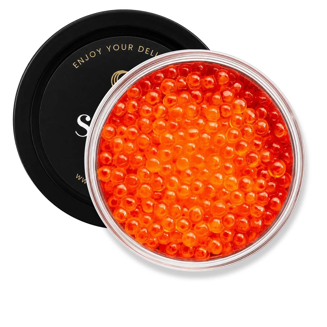 Container of orange caviar with a black lid on a white background